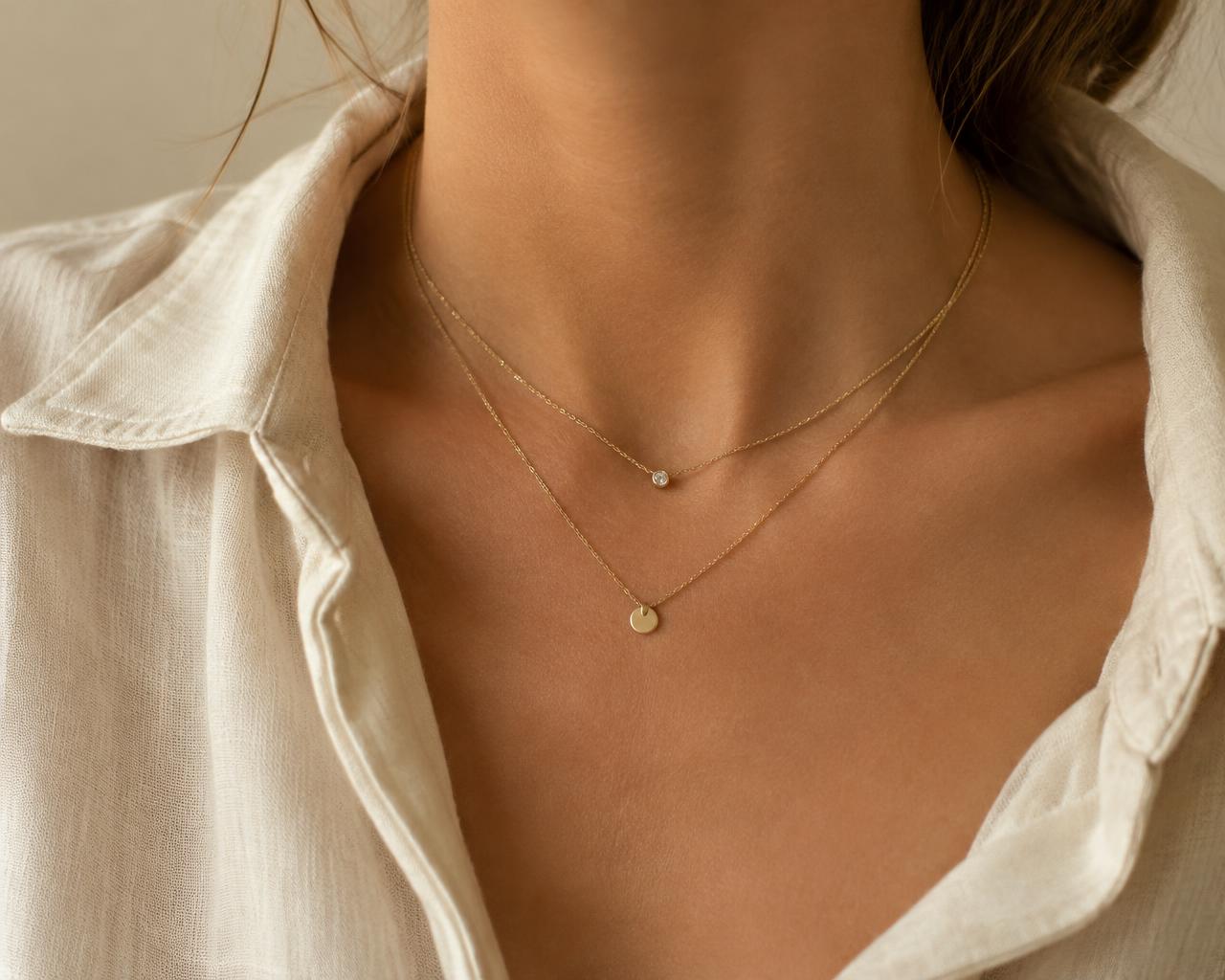 Layered gold necklaces